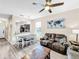 Open living room with hardwood floors and comfortable seating at 744 La Mirage St, Davenport, FL 33897