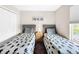 Bedroom with two twin beds and Mickey Mouse decor at 744 La Mirage St, Davenport, FL 33897