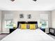 King bed, nightstands, ceiling fan, large windows at 744 La Mirage St, Davenport, FL 33897