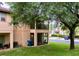 Backyard view of the house with screened patio and balcony at 744 La Mirage St, Davenport, FL 33897