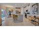 Modern kitchen with white cabinets, granite countertops, and stainless steel appliances at 12922 Trovita Dr, Grand Island, FL 32735