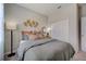 Bedroom with queen bed, and a double door closet at 12922 Trovita Dr, Grand Island, FL 32735