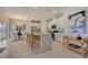 Modern kitchen with white cabinets, granite counters, and an island with seating at 12922 Trovita Dr, Grand Island, FL 32735