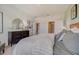 Main bedroom with wood bed frame and neutral decor at 12922 Trovita Dr, Grand Island, FL 32735