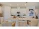 Modern kitchen with granite island and stainless steel appliances at 12922 Trovita Dr, Grand Island, FL 32735