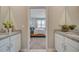 Double vanity bathroom with granite countertops and access to bedroom at 12922 Trovita Dr, Grand Island, FL 32735