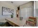 Spacious home office with a desk, window, and closet at 12922 Trovita Dr, Grand Island, FL 32735