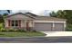 Three-car garage home with stone accents at 12922 Trovita Dr, Grand Island, FL 32735