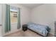 Small bedroom with twin bed and nightstand at 6316 Dolostone Dr, Lakeland, FL 33811