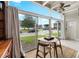 Sunroom features a table, chairs, and lake view at 151 N Orlando Ave # 131, Winter Park, FL 32789