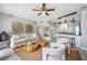 Living area features a sofa, chairs, and kitchen at 151 N Orlando Ave # 131, Winter Park, FL 32789