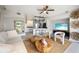 Open living room with modern furniture and kitchen view at 151 N Orlando Ave # 131, Winter Park, FL 32789