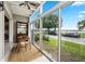 Bright sunroom with lake view and seating area at 151 N Orlando Ave # 131, Winter Park, FL 32789