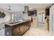 Open kitchen with a large island, granite countertops, and stainless steel appliances at 501 N Normandale Ave, Orlando, FL 32835
