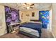 Bedroom with unique cloud ceiling, comfortable bed, and decorative wall tapestry at 501 N Normandale Ave, Orlando, FL 32835