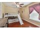 bedroom with bunk bed, slide, and plenty of floor space for play at 501 N Normandale Ave, Orlando, FL 32835