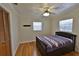 Bedroom with ceiling fan, hardwood floors, and wooden blinds at 615 Crosby Dr, Altamonte Springs, FL 32714