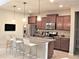 Kitchen with granite countertops and brown cabinets at 9054 Rhodes St, Kissimmee, FL 34747