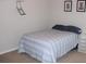 Small bedroom with full bed and shelving unit at 9054 Rhodes St, Kissimmee, FL 34747