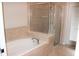 Bathroom with soaking tub and separate shower at 9054 Rhodes St, Kissimmee, FL 34747