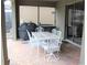 Outdoor patio with table, chairs, and built-in grill at 9054 Rhodes St, Kissimmee, FL 34747