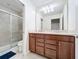 Bathroom with double vanity, shower, and toilet at 8828 Bengal Ct, Kissimmee, FL 34747