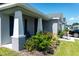 House exterior featuring a covered porch and landscaping at 3882 Willow Ridge Dr, Lakeland, FL 33810