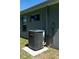 Goodman AC unit sits on a concrete slab next to the house at 3882 Willow Ridge Dr, Lakeland, FL 33810