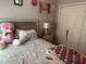 Cozy bedroom with a large teddy bear and double bed at 3882 Willow Ridge Dr, Lakeland, FL 33810