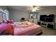 King-size bed, large TV, and decorative accents at 3882 Willow Ridge Dr, Lakeland, FL 33810