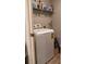 Bright laundry room with washer, dryer, and ample shelving at 3882 Willow Ridge Dr, Lakeland, FL 33810