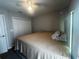 Bedroom with a king-size bed and double doors at 3882 Willow Ridge Dr, Lakeland, FL 33810