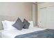 King bedroom with gray bedding and textured wall at 1692 Tropical Palms Cir, Kissimmee, FL 34747