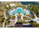 Community pool with lounge chairs and cabanas at 1692 Tropical Palms Cir, Kissimmee, FL 34747