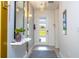 Modern entryway with white door, tile floor, and console table at 1692 Tropical Palms Cir, Kissimmee, FL 34747