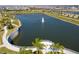 Scenic lake with walking path and seating area at 1692 Tropical Palms Cir, Kissimmee, FL 34747