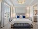 Main bedroom with plush bedding and elegant decor at 1692 Tropical Palms Cir, Kissimmee, FL 34747