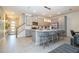 Modern kitchen with stainless steel appliances and a large island at 1692 Tropical Palms Cir, Kissimmee, FL 34747