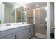 Modern bathroom with double vanity and walk-in shower at 1692 Tropical Palms Cir, Kissimmee, FL 34747
