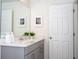 Clean bathroom with gray vanity and a large mirror at 1692 Tropical Palms Cir, Kissimmee, FL 34747