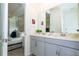 Double vanity bathroom with access to bedroom at 1692 Tropical Palms Cir, Kissimmee, FL 34747