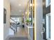 Bright and spacious entryway with modern light fixtures and a stylish console table at 1692 Tropical Palms Cir, Kissimmee, FL 34747