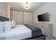 King-size bed in a spacious bedroom with large TV at 1692 Tropical Palms Cir, Kissimmee, FL 34747