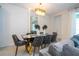 Elegant dining room featuring a modern table and chairs at 1692 Tropical Palms Cir, Kissimmee, FL 34747
