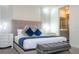 Spacious bedroom with plush bedding and en-suite bathroom at 1692 Tropical Palms Cir, Kissimmee, FL 34747