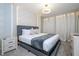 Spacious main bedroom with a king-size bed and modern decor at 1692 Tropical Palms Cir, Kissimmee, FL 34747