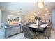 Open concept dining room with modern table and chairs at 1692 Tropical Palms Cir, Kissimmee, FL 34747