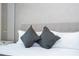 King bedroom with gray bedding and textured wall at 1692 Tropical Palms Cir, Kissimmee, FL 34747