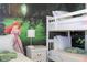 bedroom with bunk beds and a mermaid mural at 1692 Tropical Palms Cir, Kissimmee, FL 34747