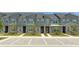 Modern townhouses with gray siding and stone accents at 1692 Tropical Palms Cir, Kissimmee, FL 34747